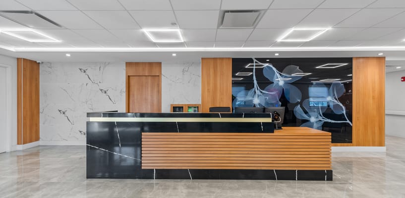Modern reception area with wooden and marble finishes