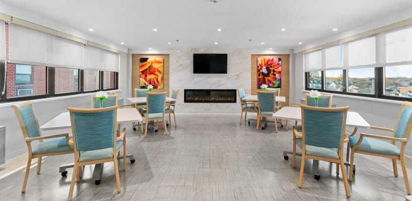 Bright common area with tables and chairs