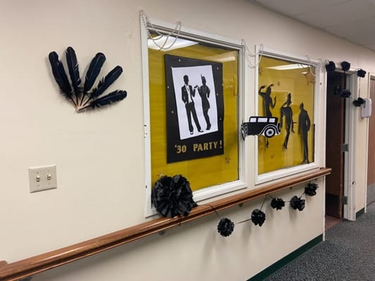 Decorations for a 30s themed party in a hallway