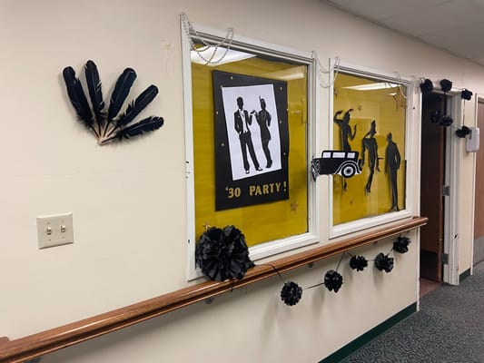 Decorations for a 30s themed party in a hallway