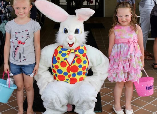 Children posing with an Easter Bunny character