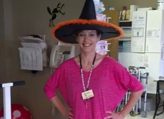 Staff member dressed in a festive Halloween costume