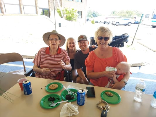 Residents and family enjoying cookies outdoors