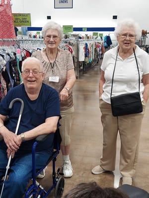 Three residents in a bright activity space
