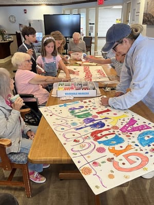 Residents and children creating colorful art together
