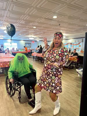 Residents and staff celebrating at a festive event