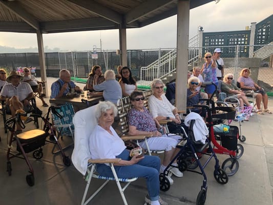 Residents enjoying time together outdoors at a gathering