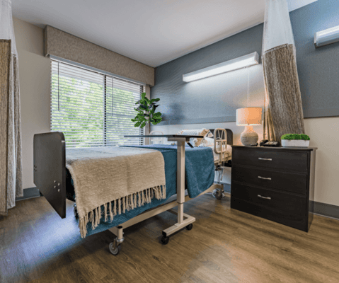 Cozy private resident room with a bed and natural light