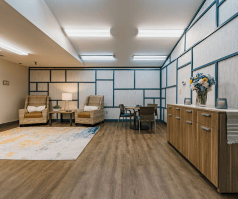 A well-furnished common area in a senior living facility