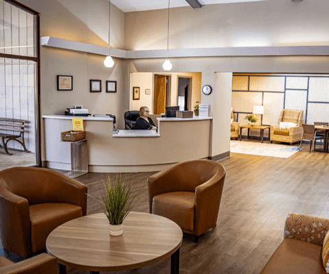 Cozy common area with seating and reception desk
