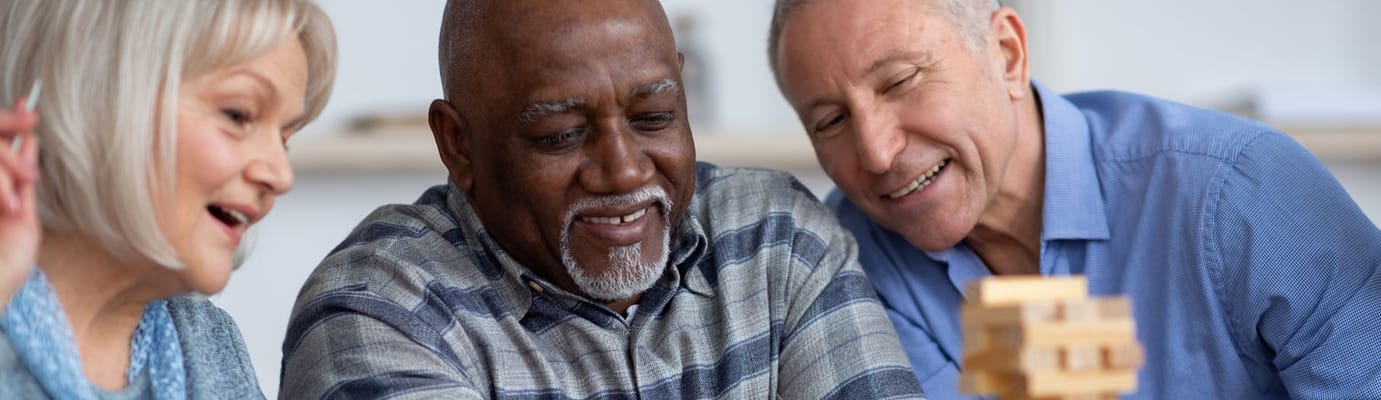 Residents enjoying a game in a social setting