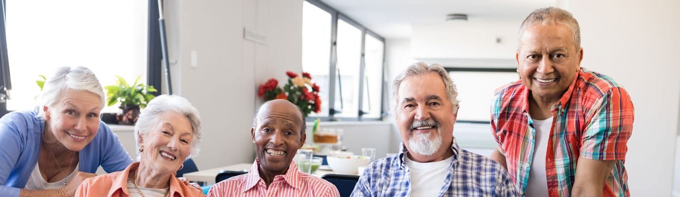 Group of smiling senior residents in a common area