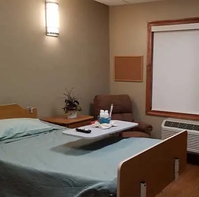 Cozy private resident room with bed and chair