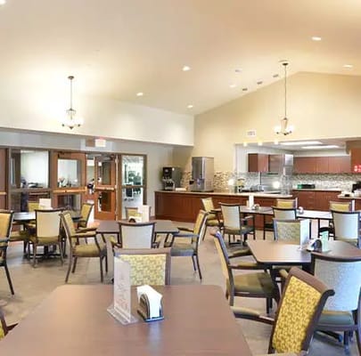Bright interior view of a dining room with tables and chairs