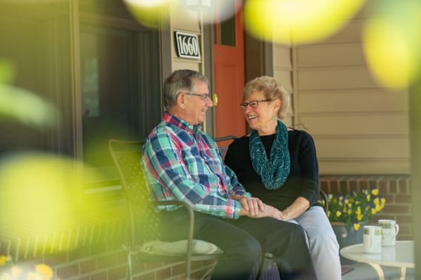 Couple enjoying time together on a porch