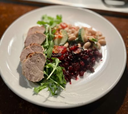 A plated meal with various food items arranged attractively