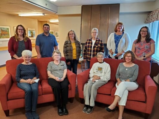 Residents and staff gathered in a common area