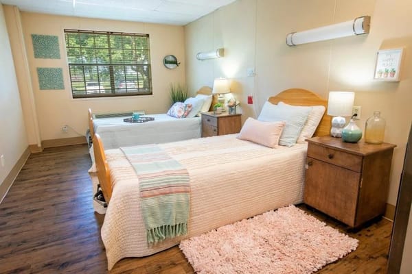 Bright, cozy resident room with two beds