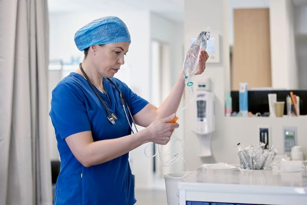 Nurse preparing medication in a care facility