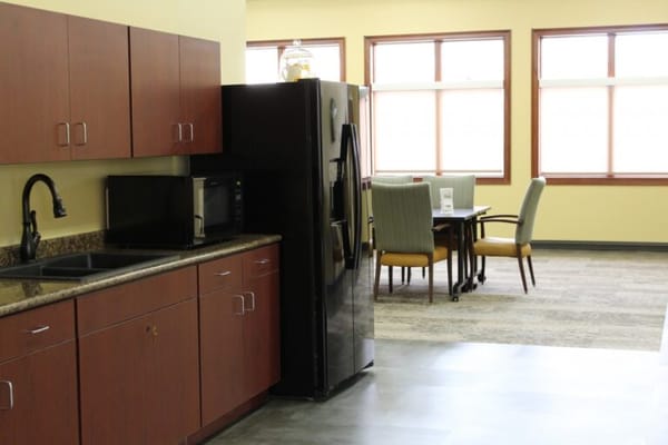 Interior view of a communal kitchen and dining area
