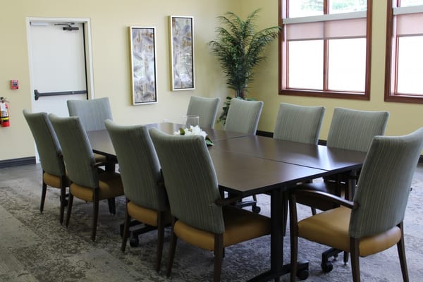 Meeting room with a long table and chairs