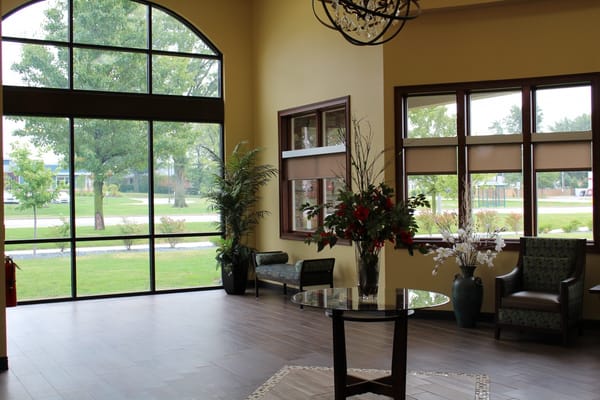 Bright interior lobby area with seating and plants