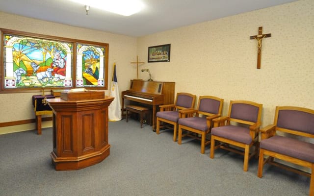 Interior view of a chapel with wooden furnishings