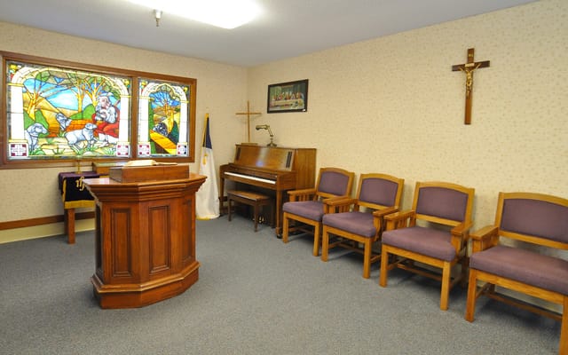 Interior view of a chapel with wooden furnishings