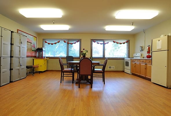 Dining area with tables and chairs in a well-lit room