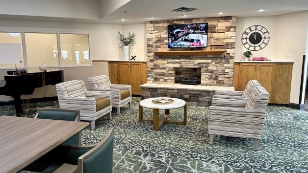 Common area with seating and fireplace