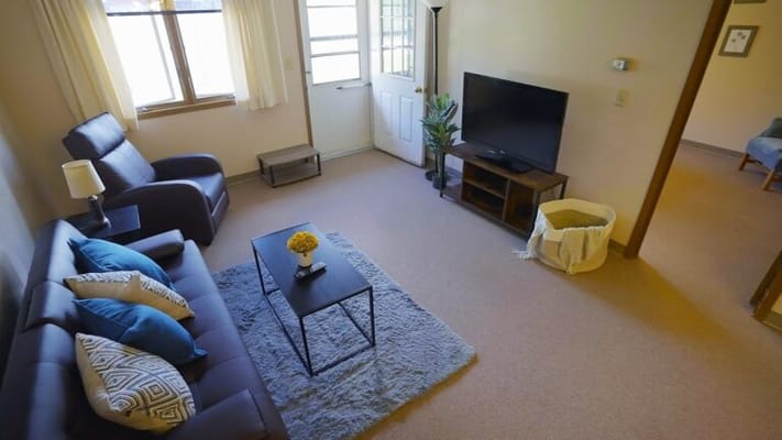 Cozy living area with a sofa and TV