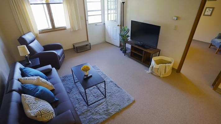 Cozy living area with a sofa and TV