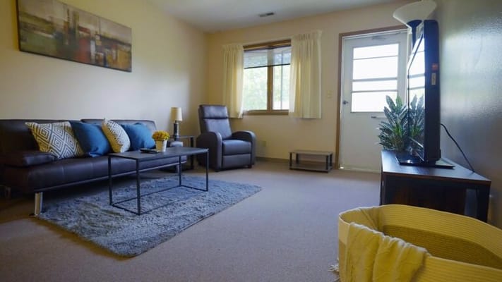 Bright common area with seating and natural light
