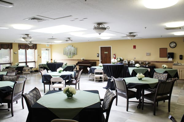 Spacious interior dining area with tables and flowers