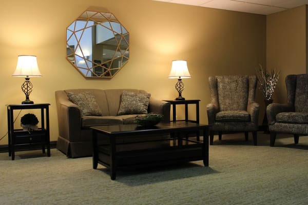 Cozy common area with comfortable seating and lamps