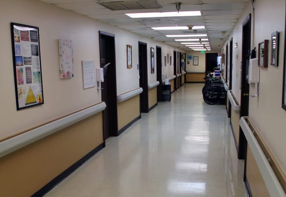 Hallway with resident rooms and decorations on the walls