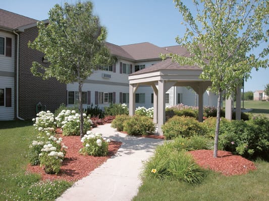 Landscaped pathway leading to building entrance