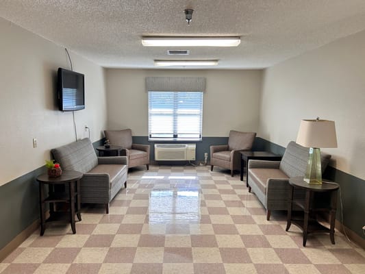 Cozy sitting area with chairs and natural light