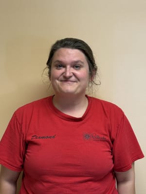 Staff member posing for a photo in uniform