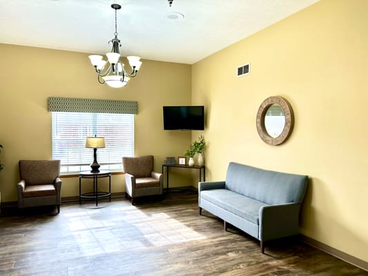 Cozy common area with seating and warm lighting