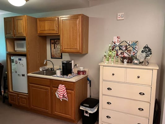 Well-furnished kitchenette in a senior living space