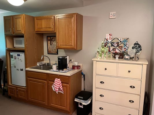 Well-furnished kitchenette in a senior living space