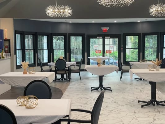 Elegant dining room with tables set for service
