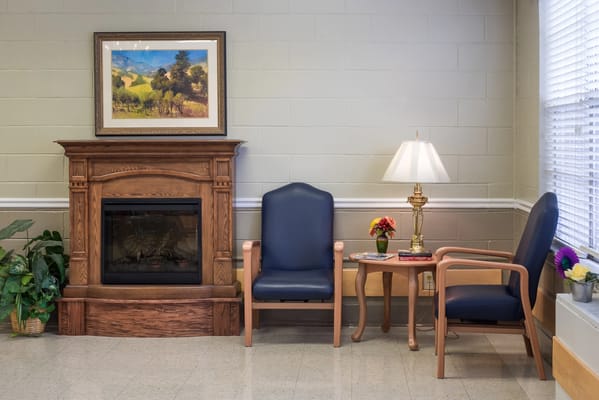 Cozy lounge area with fireplace and seating