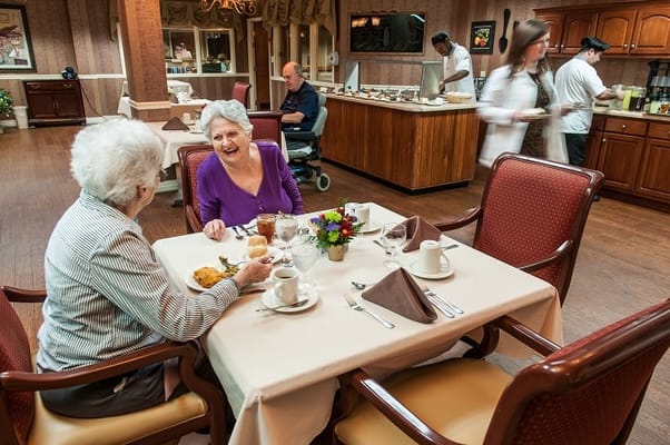 Residents enjoying a meal in a dining area