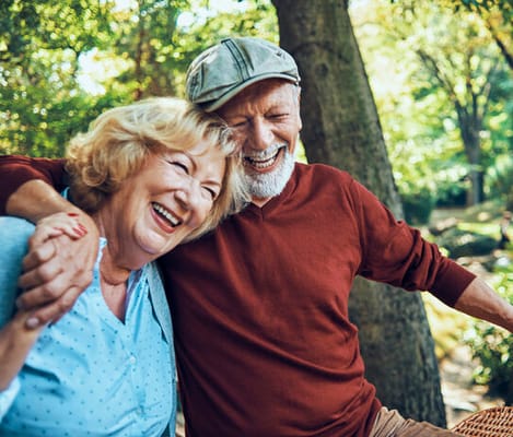 Two residents enjoying time outdoors and laughing