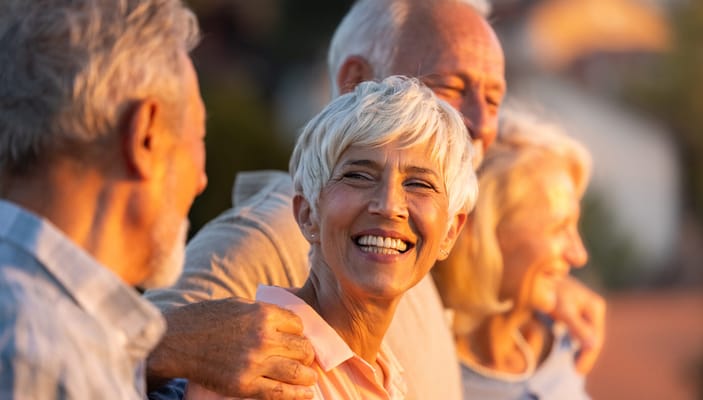 Group of smiling seniors enjoying time together