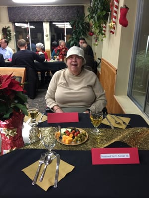 A resident enjoying a festive dining experience