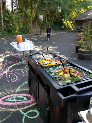 Outdoor food cart with fresh fruit and drinks