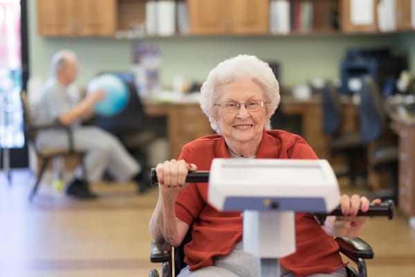 Senior resident engaging in an exercise activity indoors